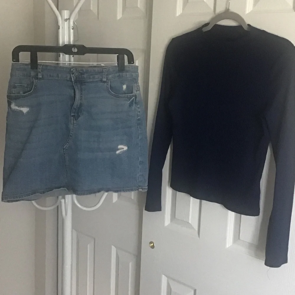 Fray features blue denim skirt with free knit top